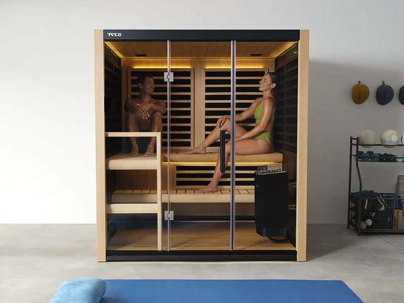 Tylö home sauna with two people relaxing